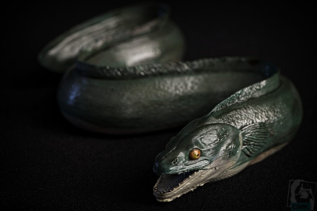 Art print inspired by Post Mortem by Frank van de Goot, featuring an eel as the central form.